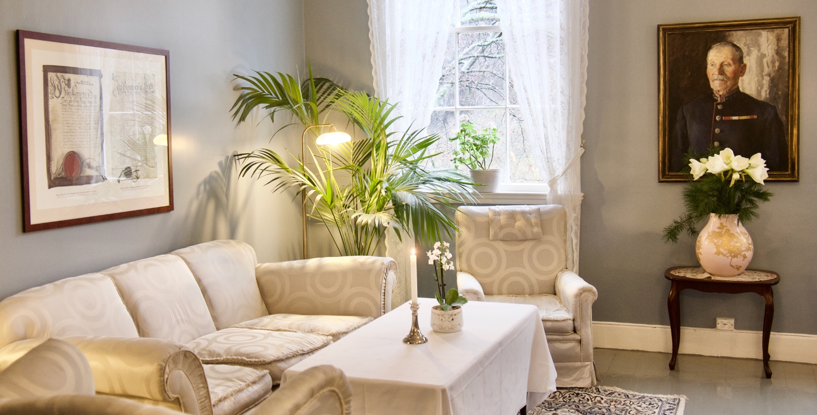 a living room with a table and chairs