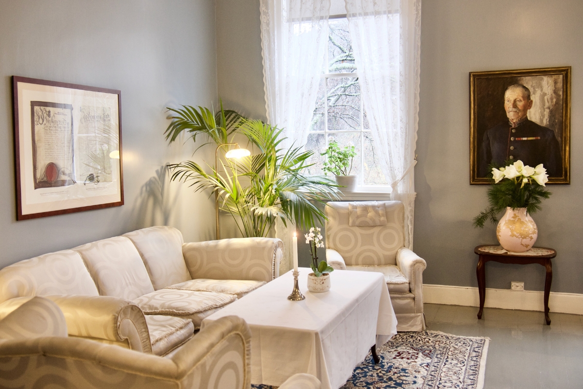 a living room with a table and chairs