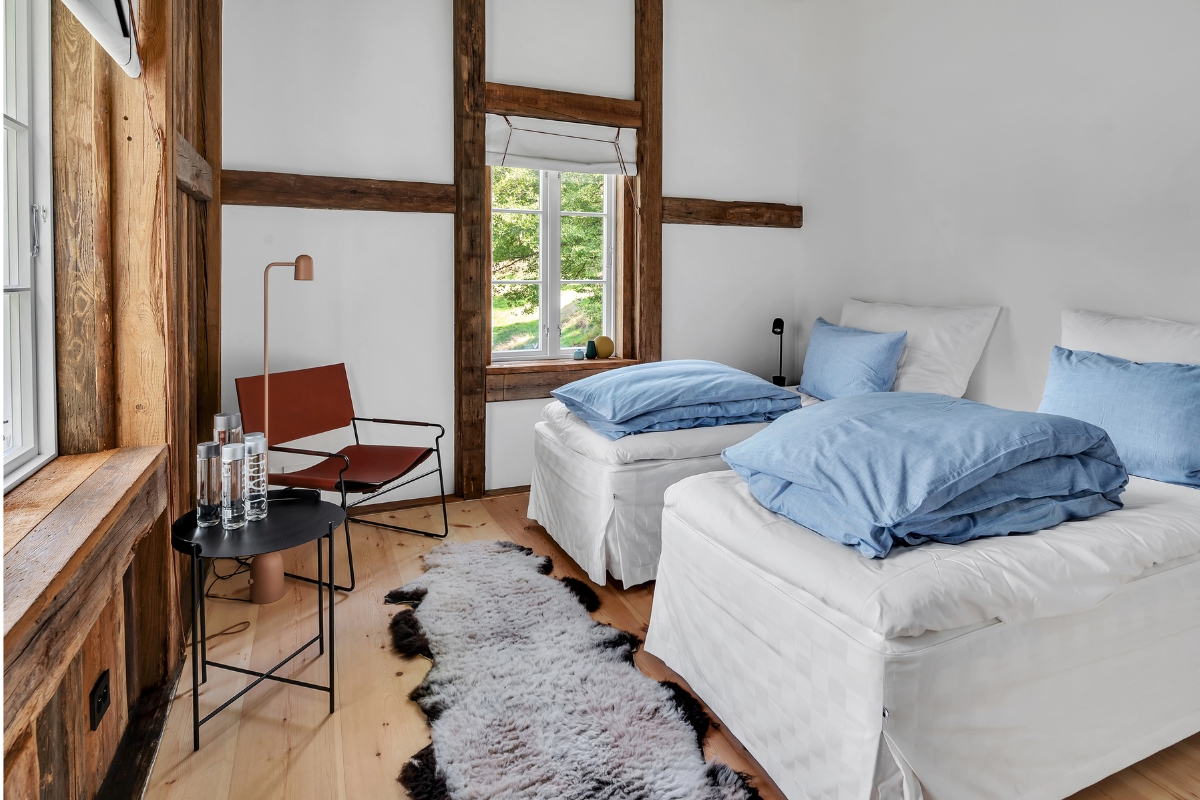 a room with a bed and a rug