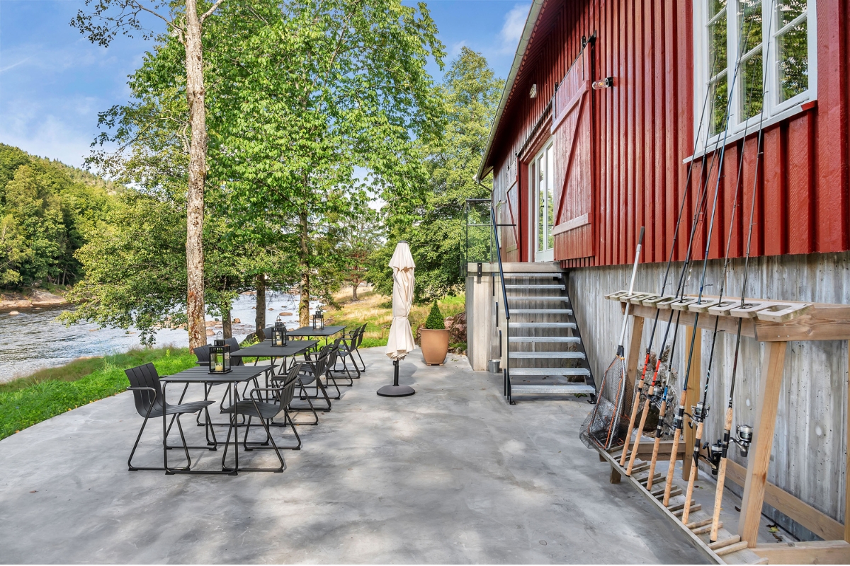 a patio with fishing rods and chairs