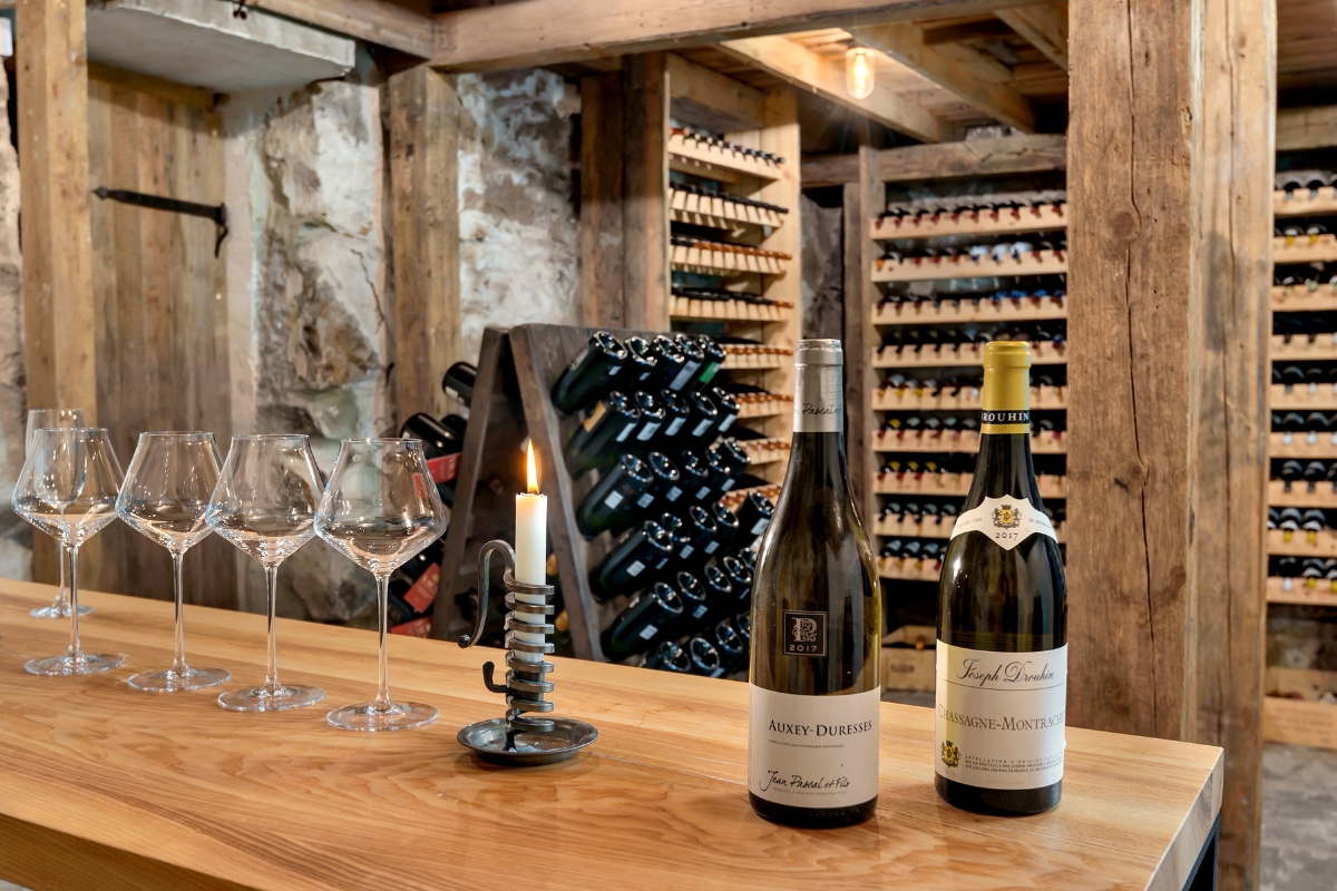 wine bottles and glasses on a table