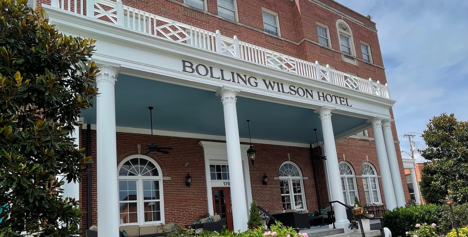 a building with columns and a sign