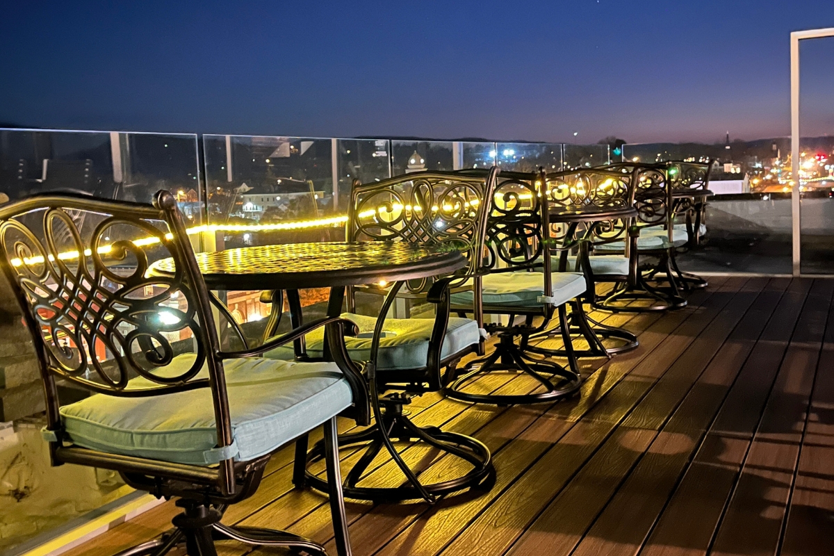 a table and chairs on a deck