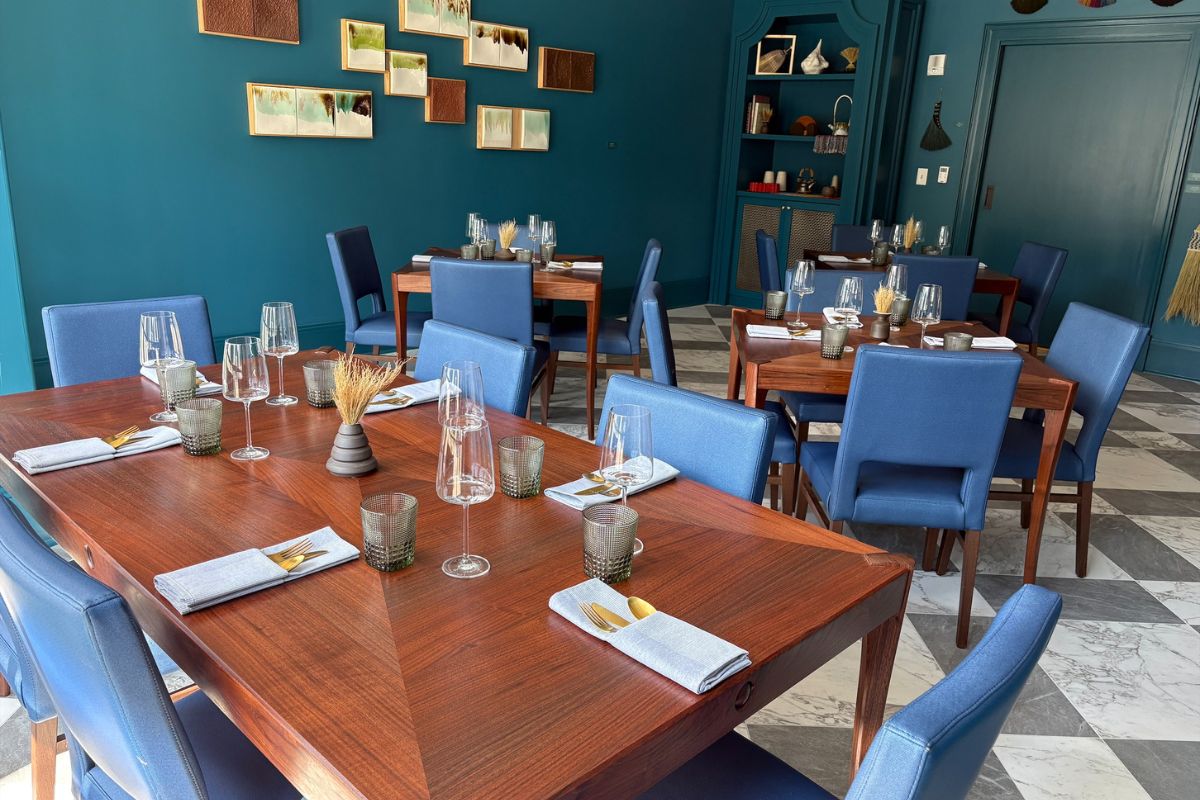 a room with blue chairs and tables