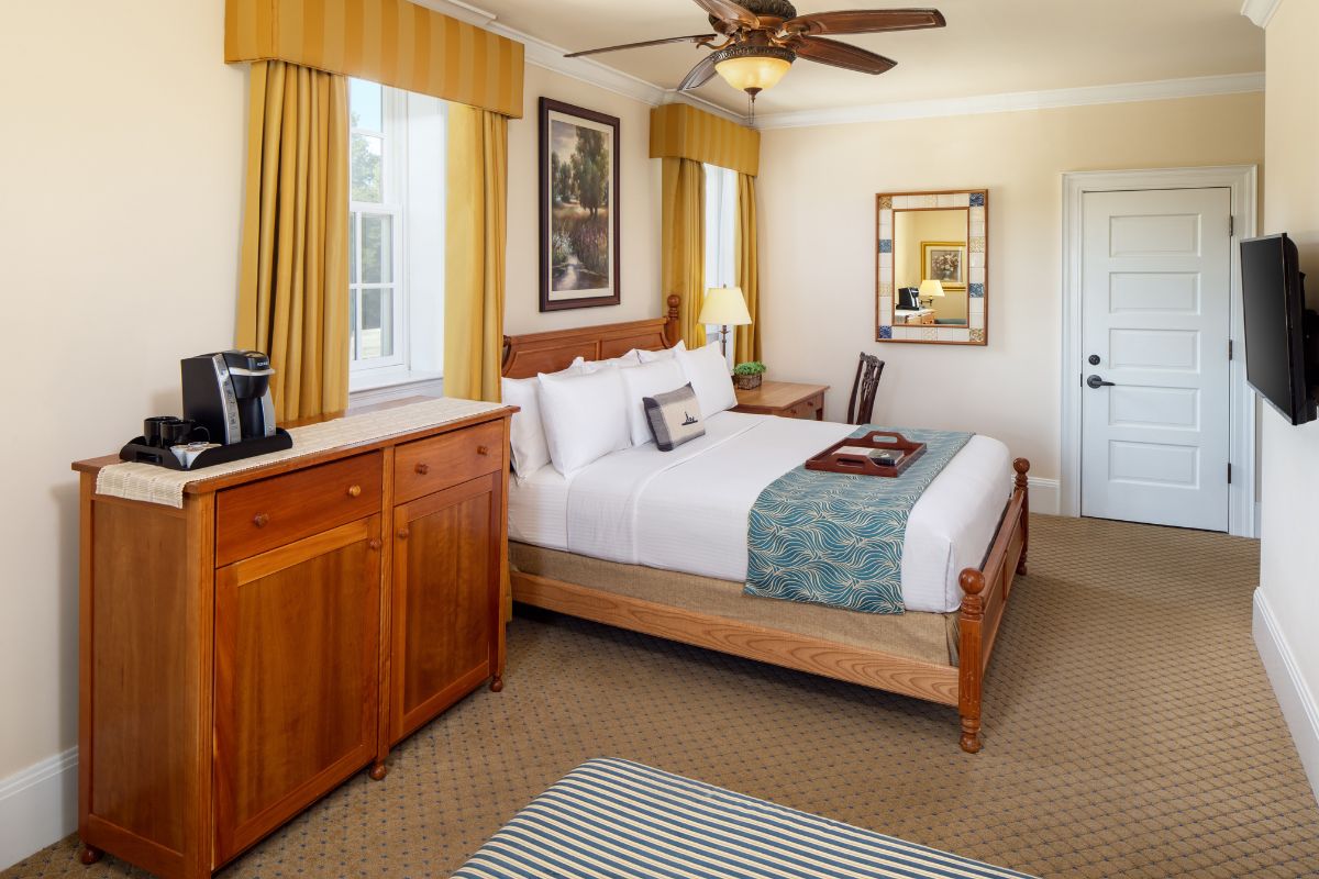 a room with a bed and a coffee maker