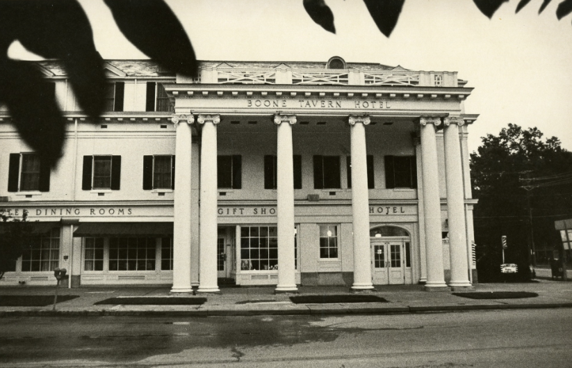 a building with columns and a street corner