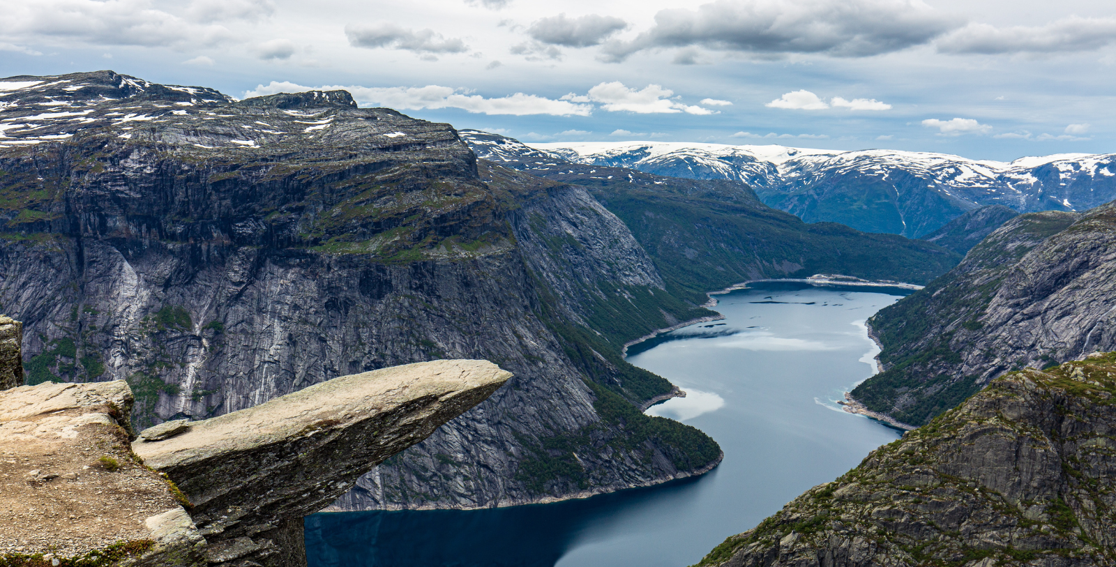a rock cliff over water