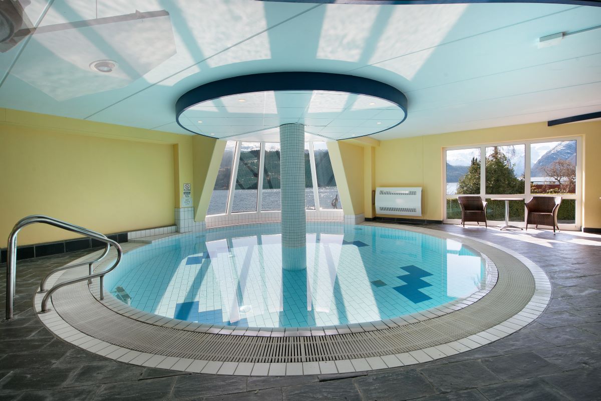 a swimming pool with a large pole