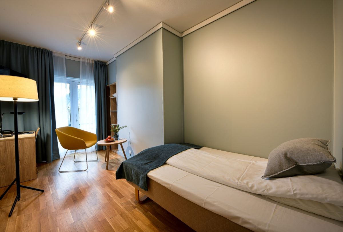a room with a bed and a chair