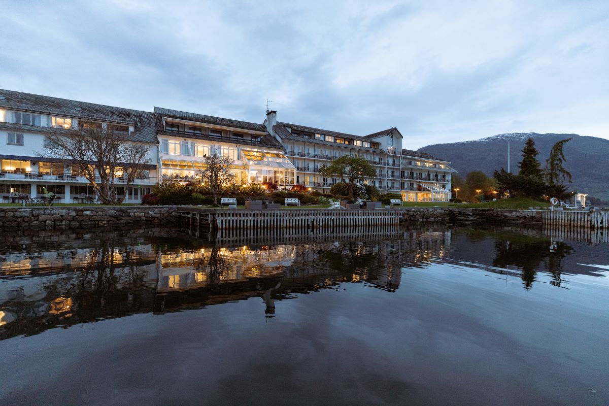 a building next to a body of water