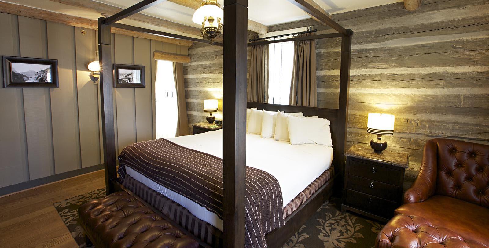 a bed with a four poster bed