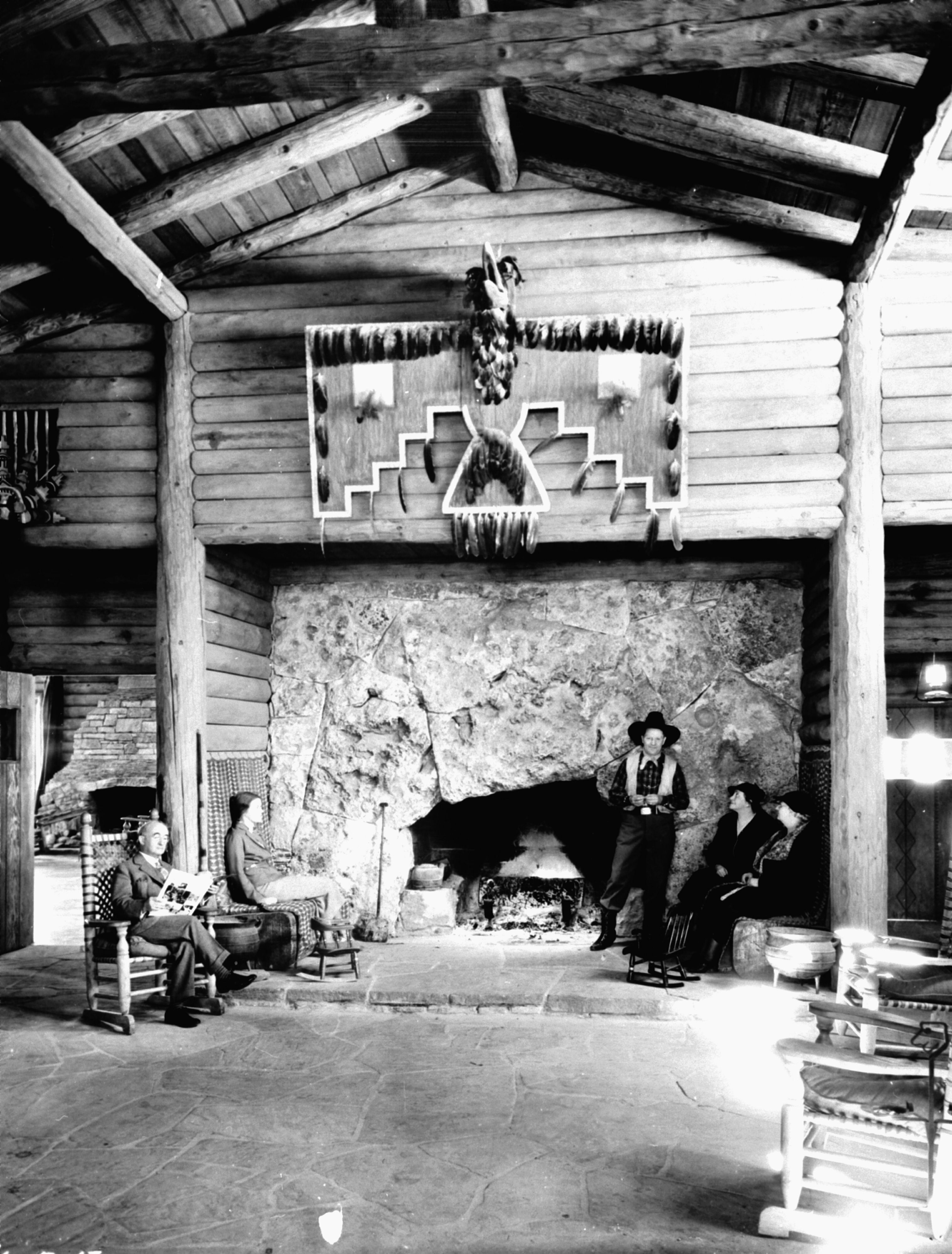 a group of people in a log cabin