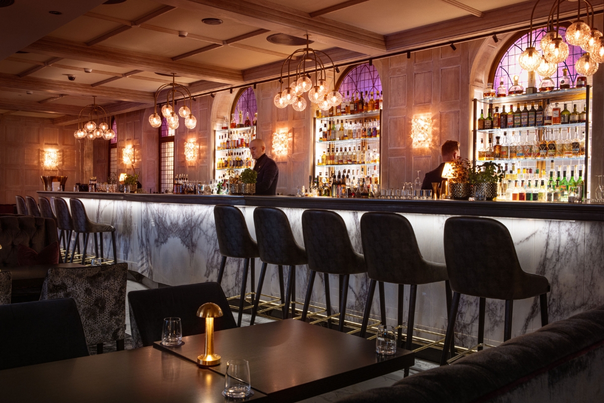 a bar with a counter and chairs