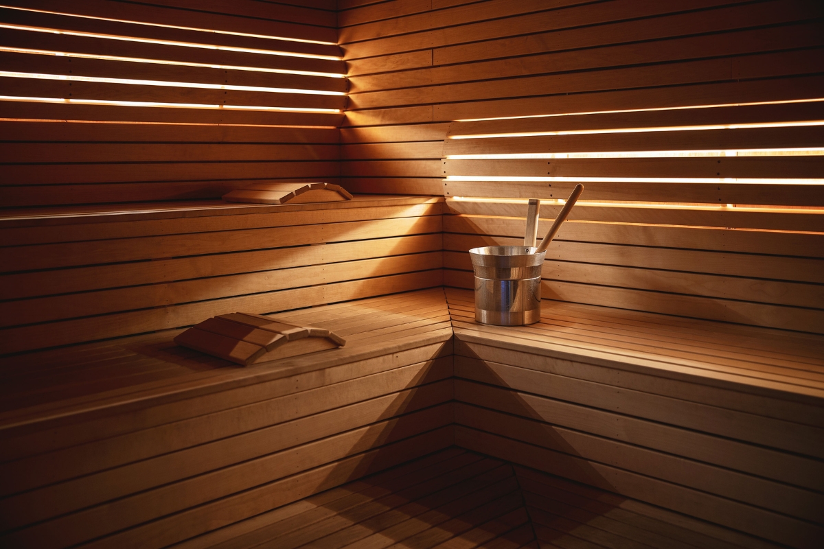 a wooden sauna with bucket and shovels