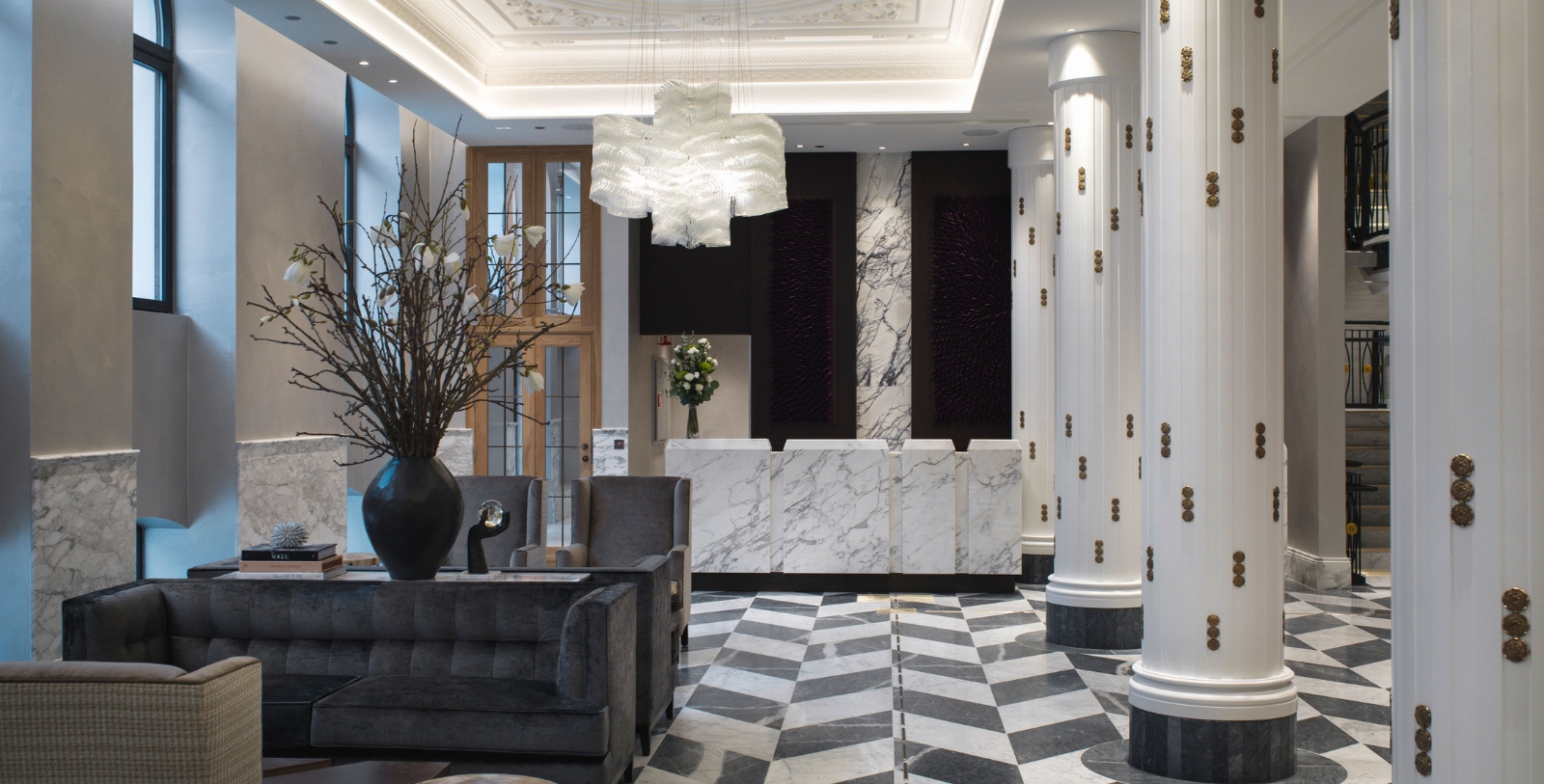 a lobby with marble counter and chairs