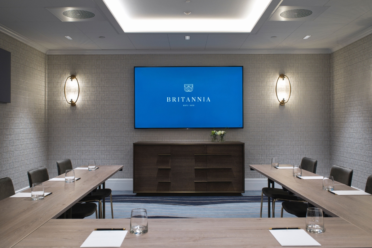 a room with a large screen on the wall