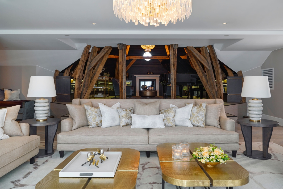 a living room with a couch and coffee tables