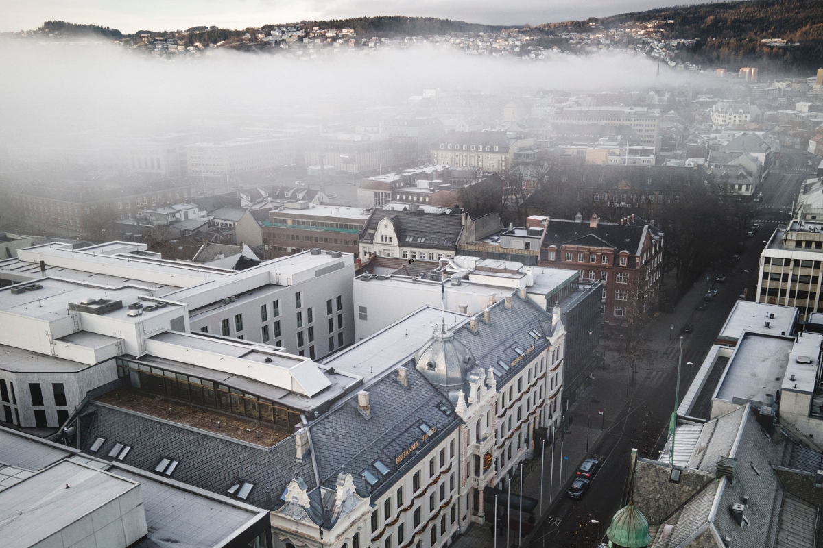 a city with fog and buildings