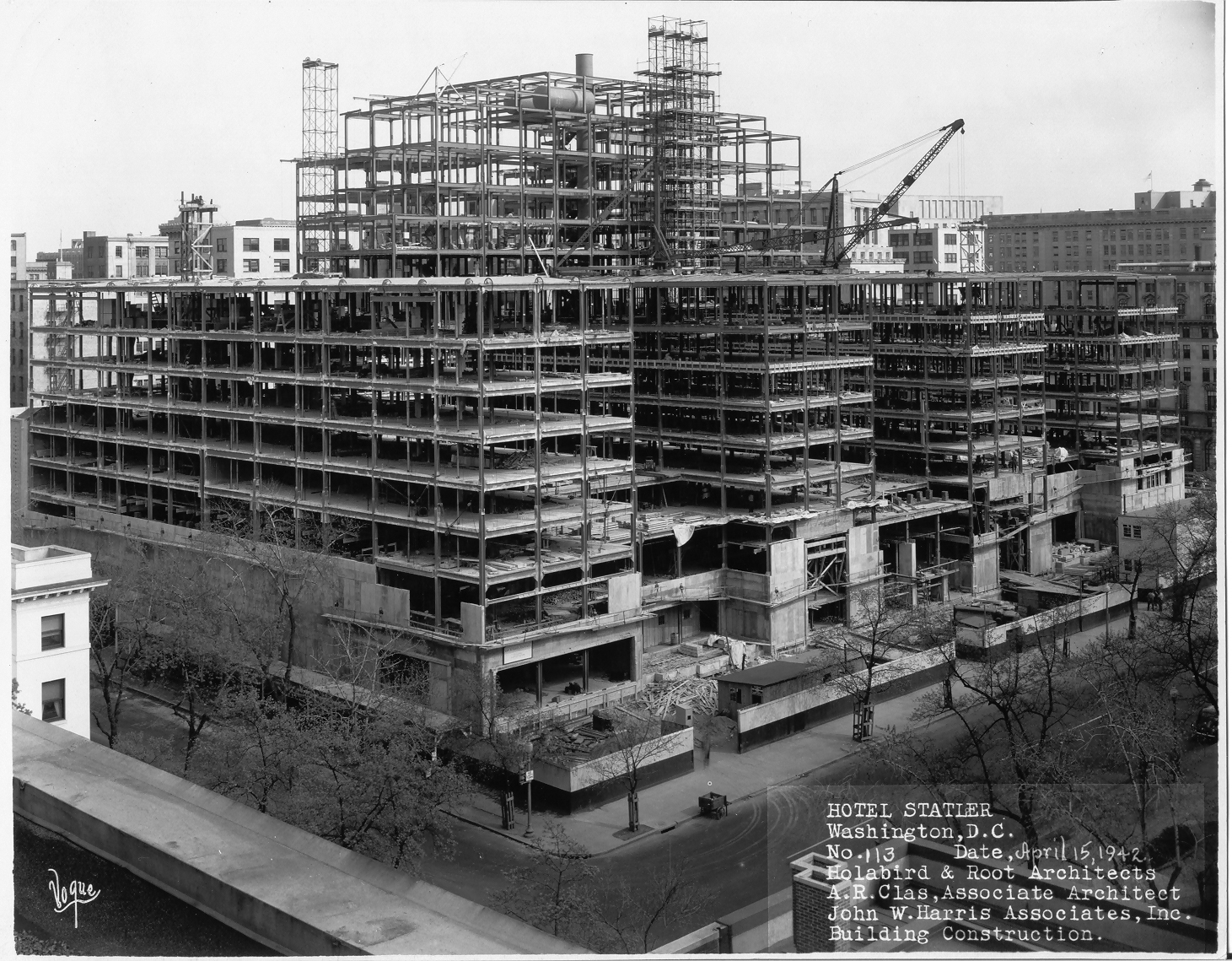 a building under construction with cranes