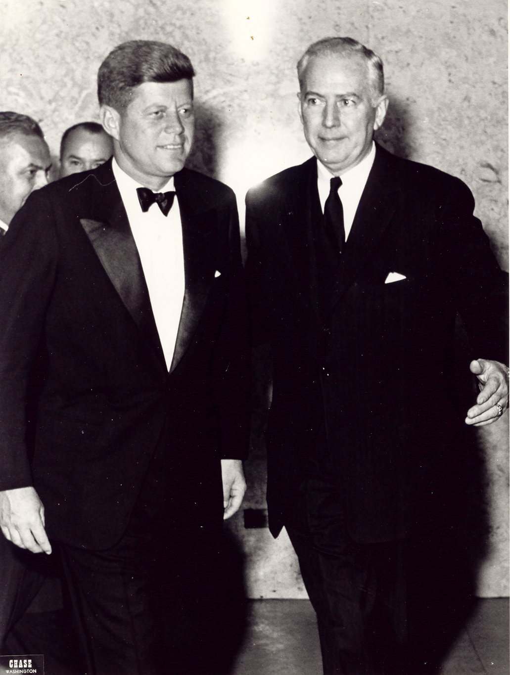 a couple of men in suits