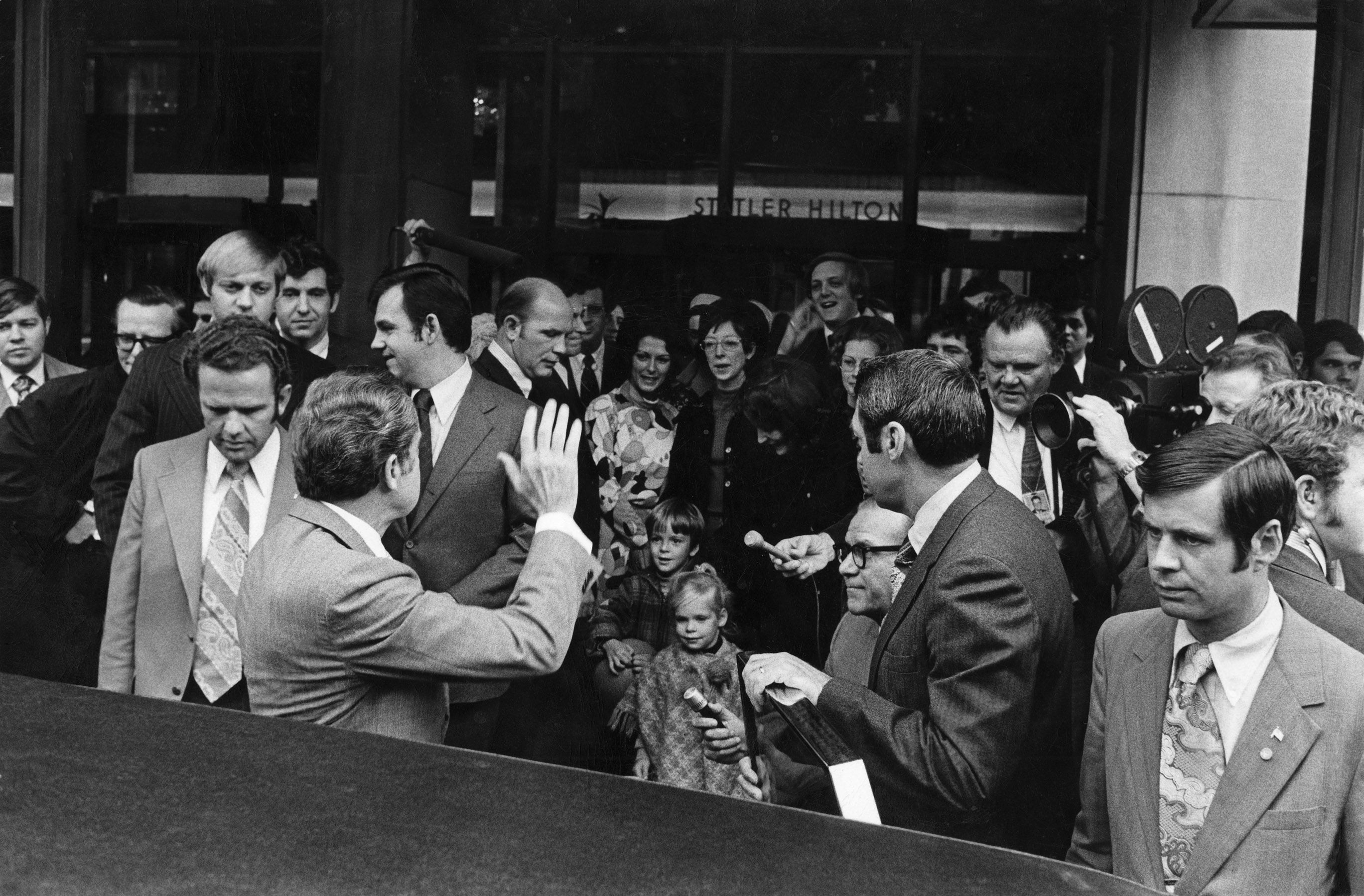 a group of people standing in front of a crowd