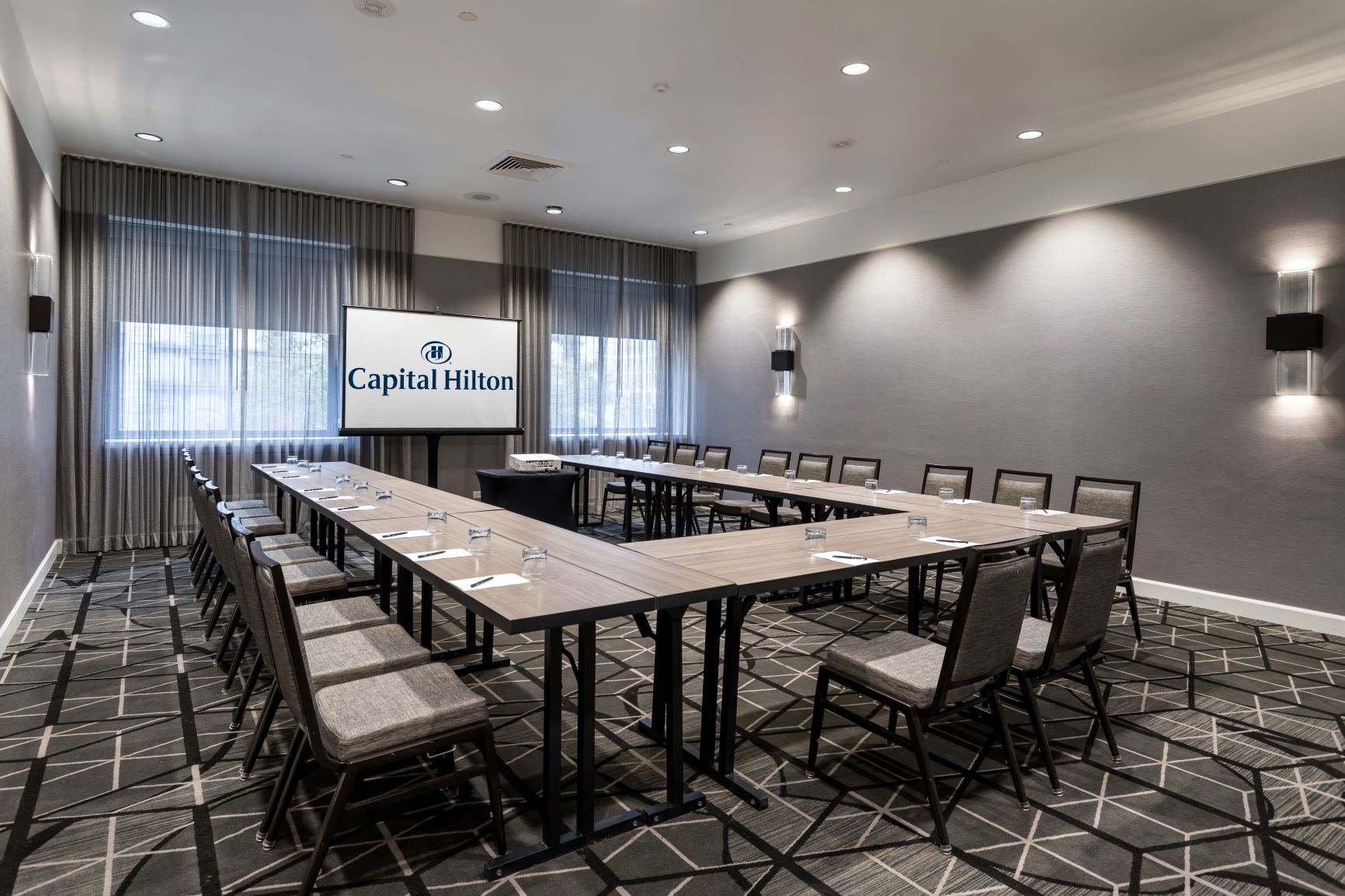 a room with a large table and chairs