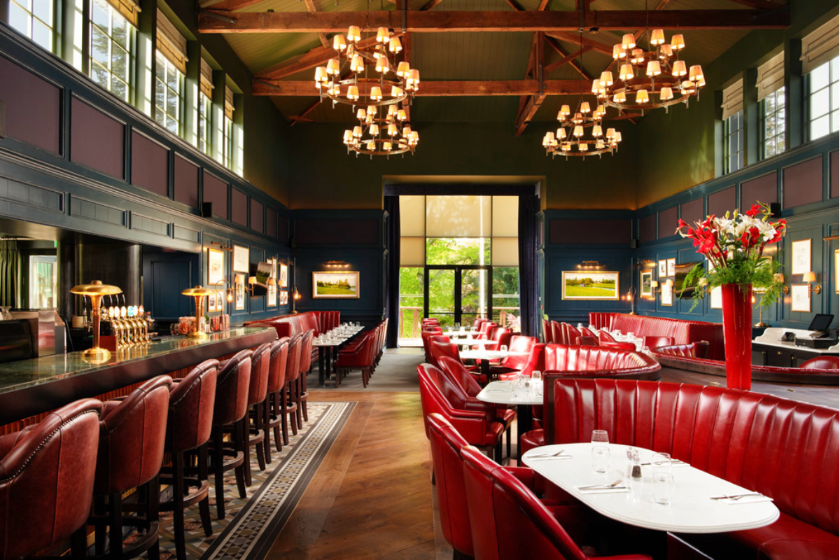 a restaurant with red chairs and tables