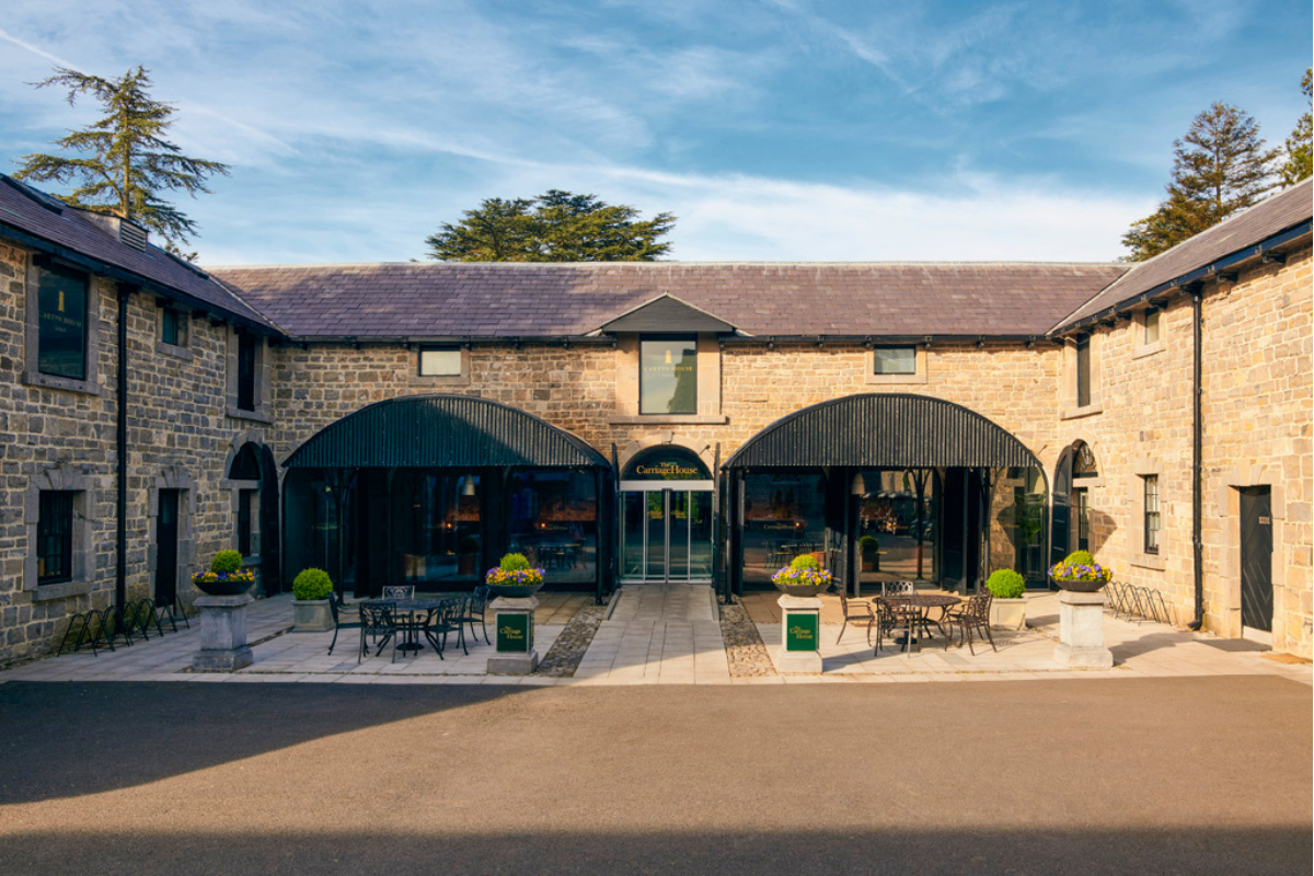a building with a stone wall and a stone wall with a stone wall and a stone wall with a stone wall and a stone wall with a stone wall and a stone wall with a stone wall and