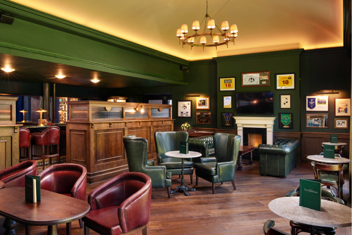 a room with green walls and green furniture