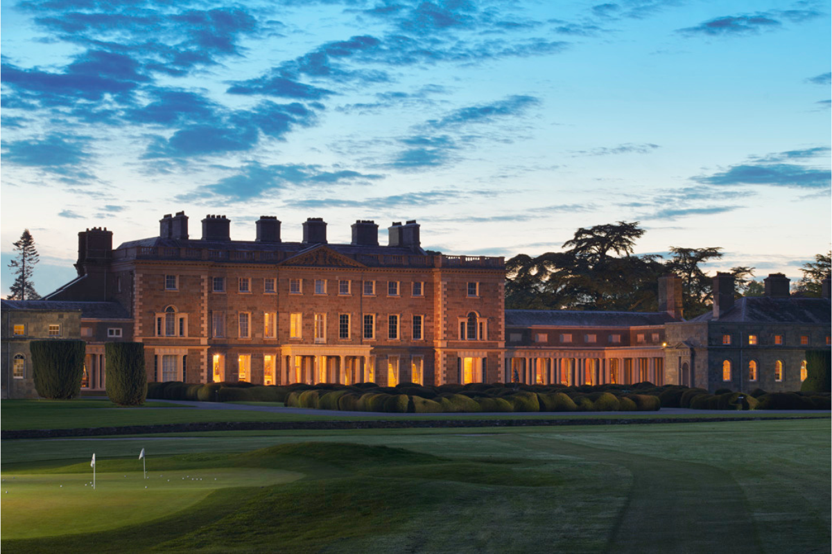 a large building with a golf course and a golf course
