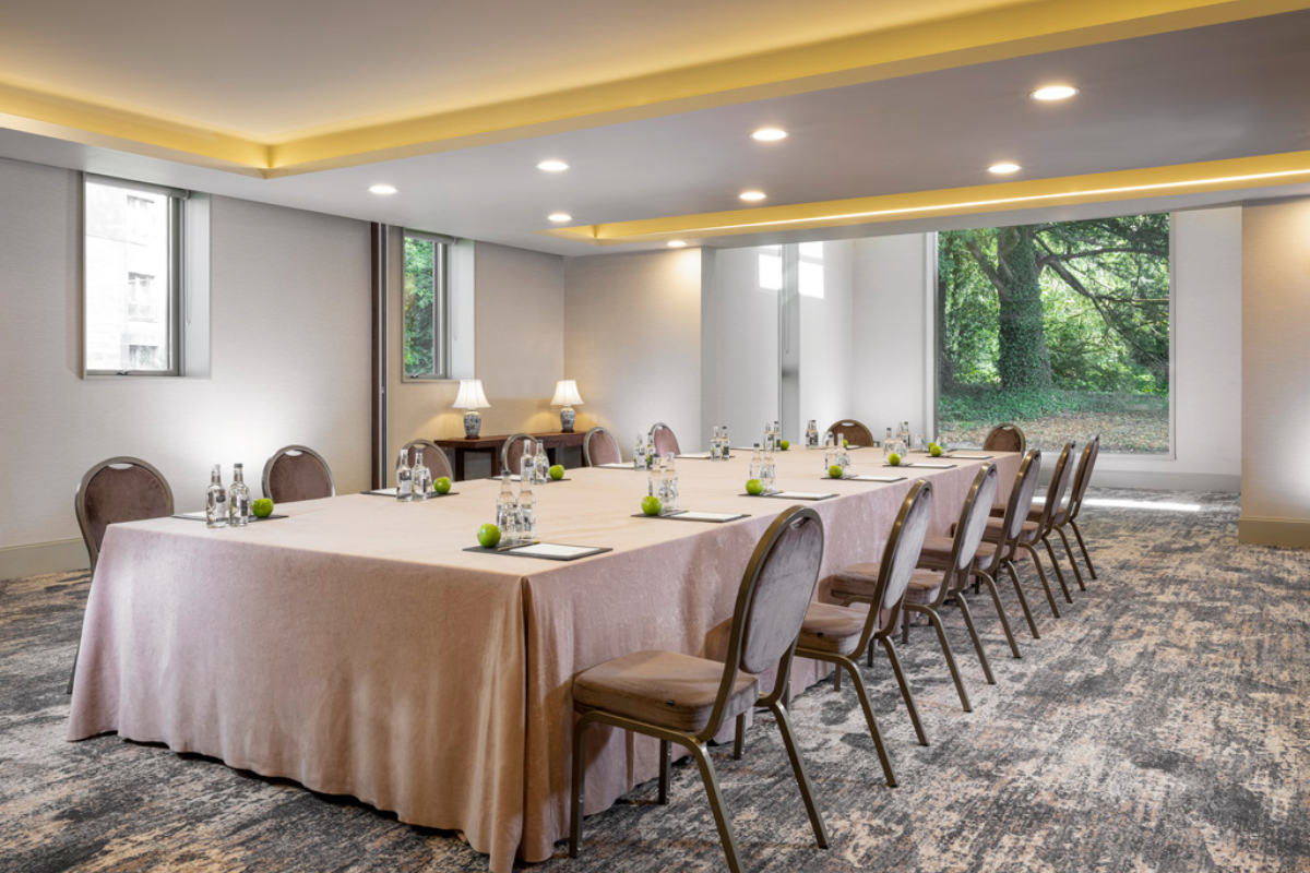 a large conference room with a table and chairs