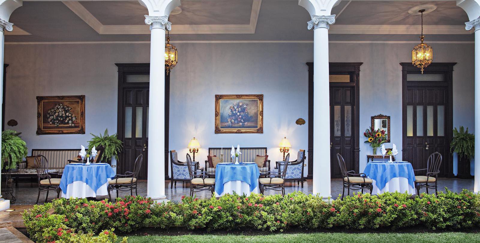a patio with a table and chairs
