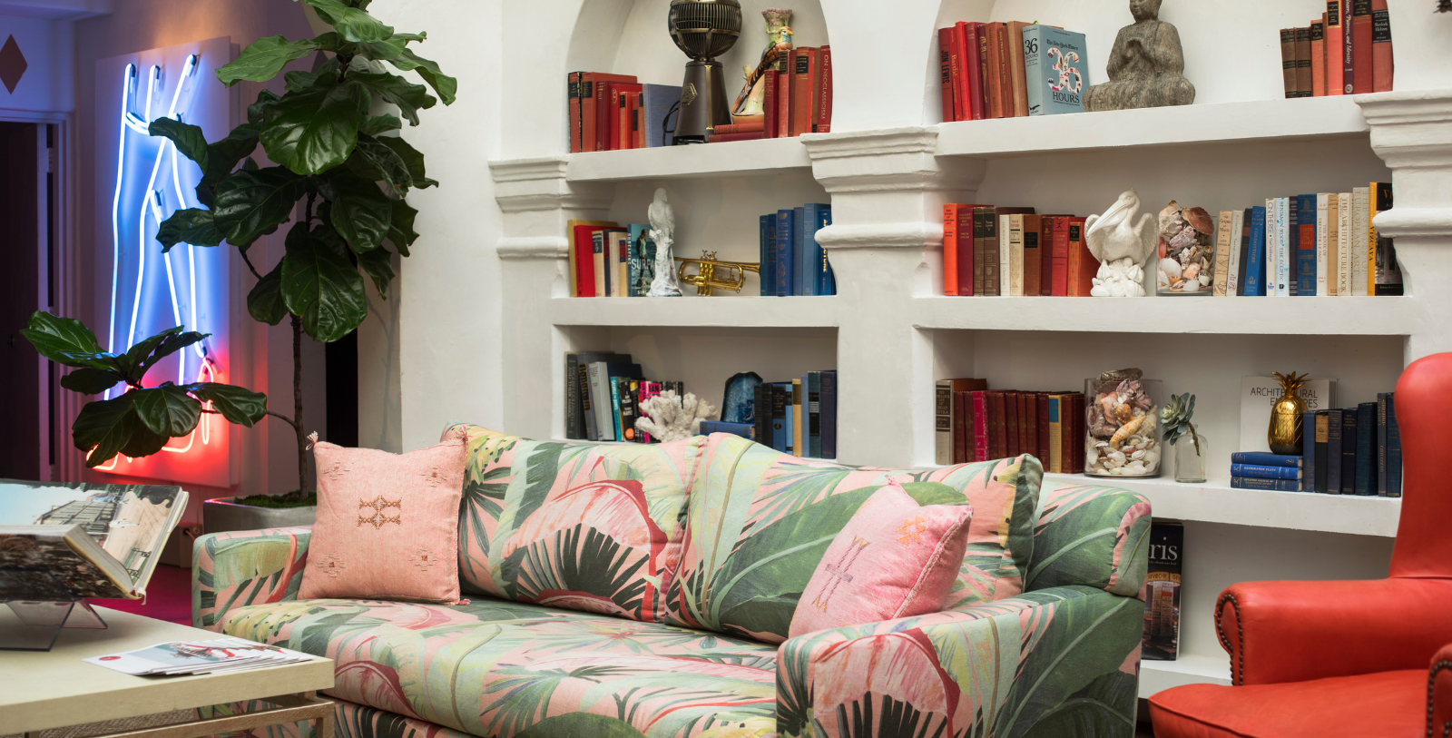a couch in a room with books on shelves