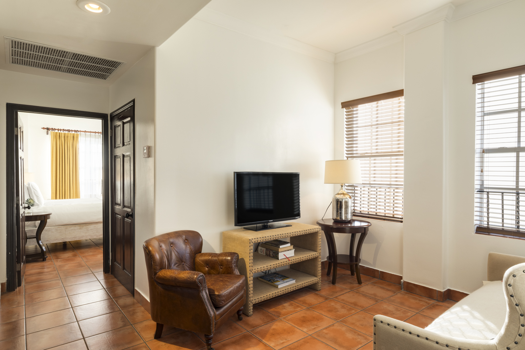 a living room with a tv and a table
