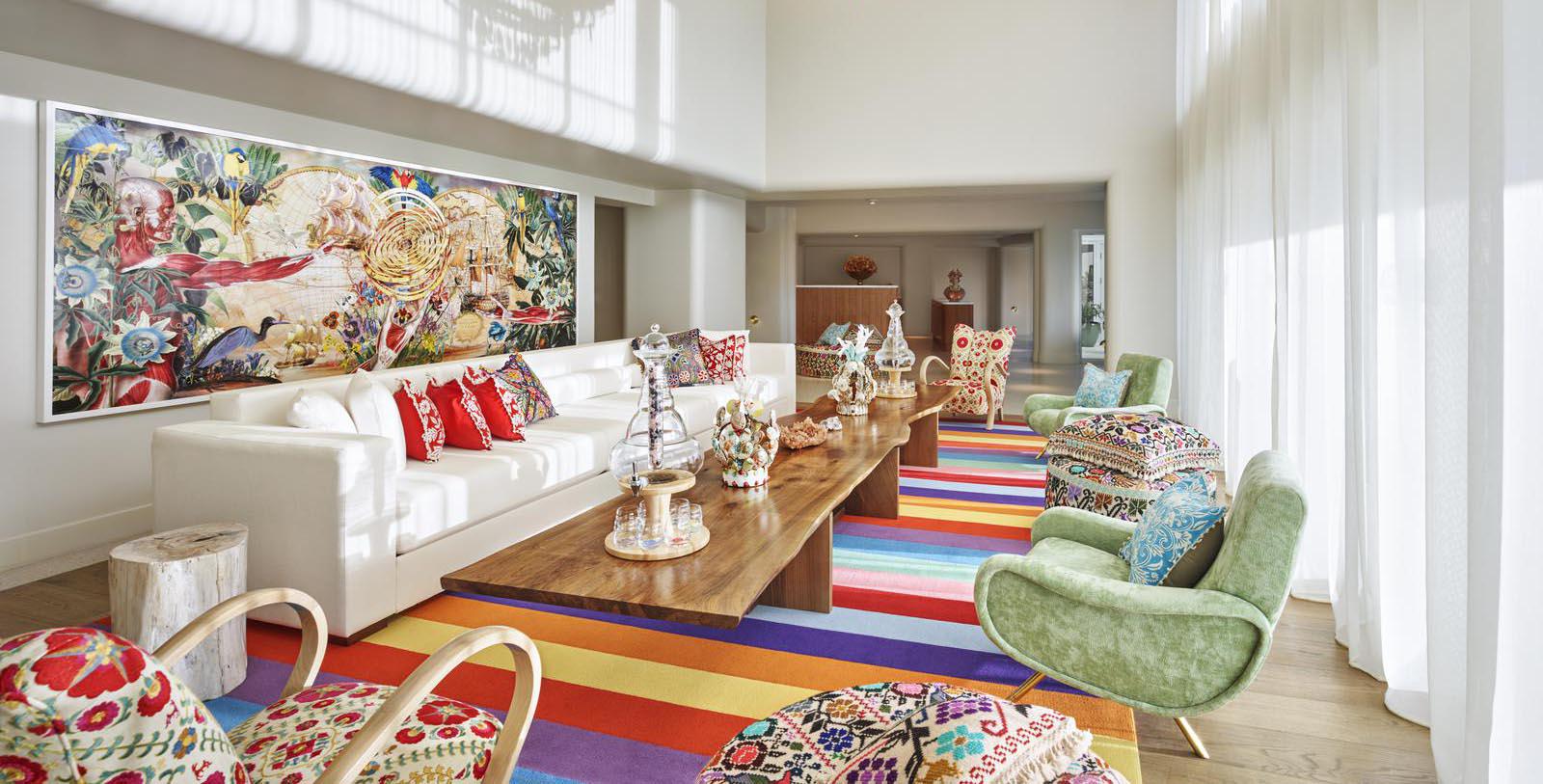 a room with colorful chairs and a table
