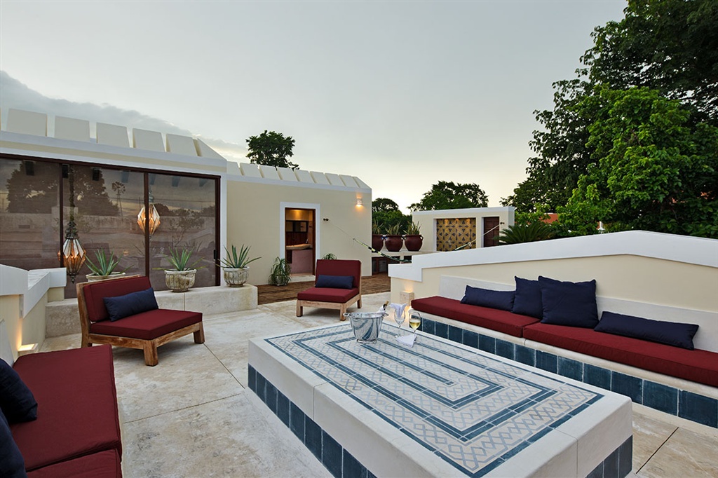 a patio with a table and chairs