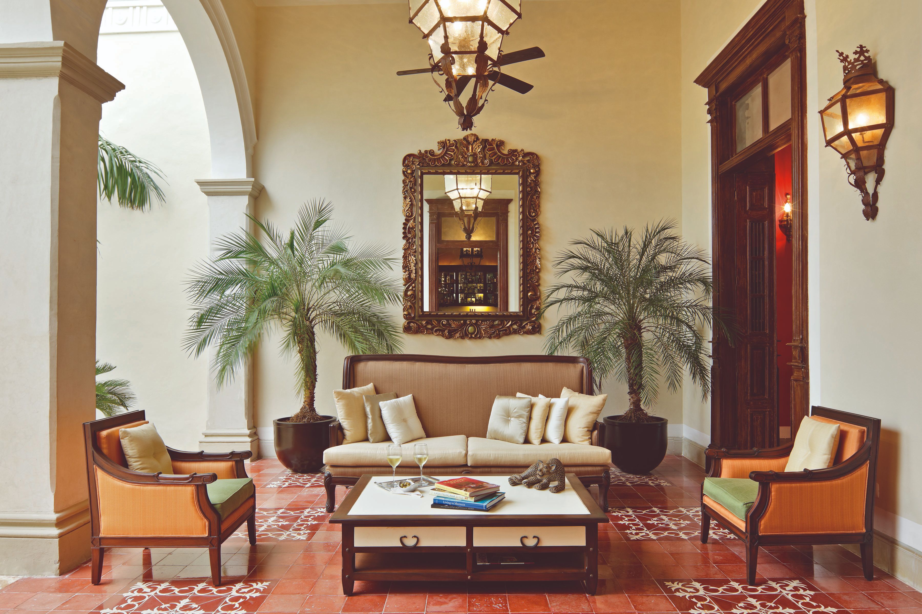 a room with a mirror and couches