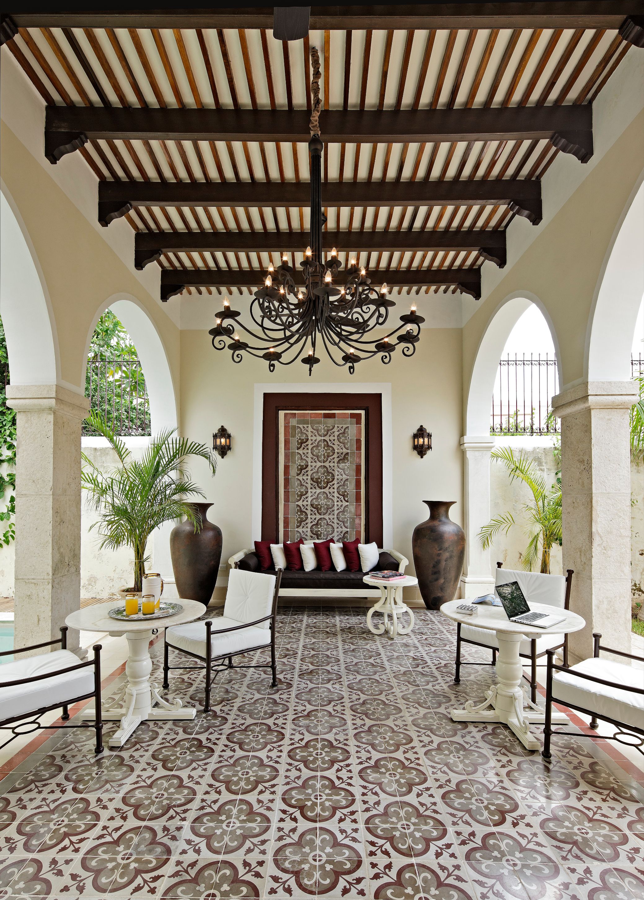 a room with a chandelier and chairs