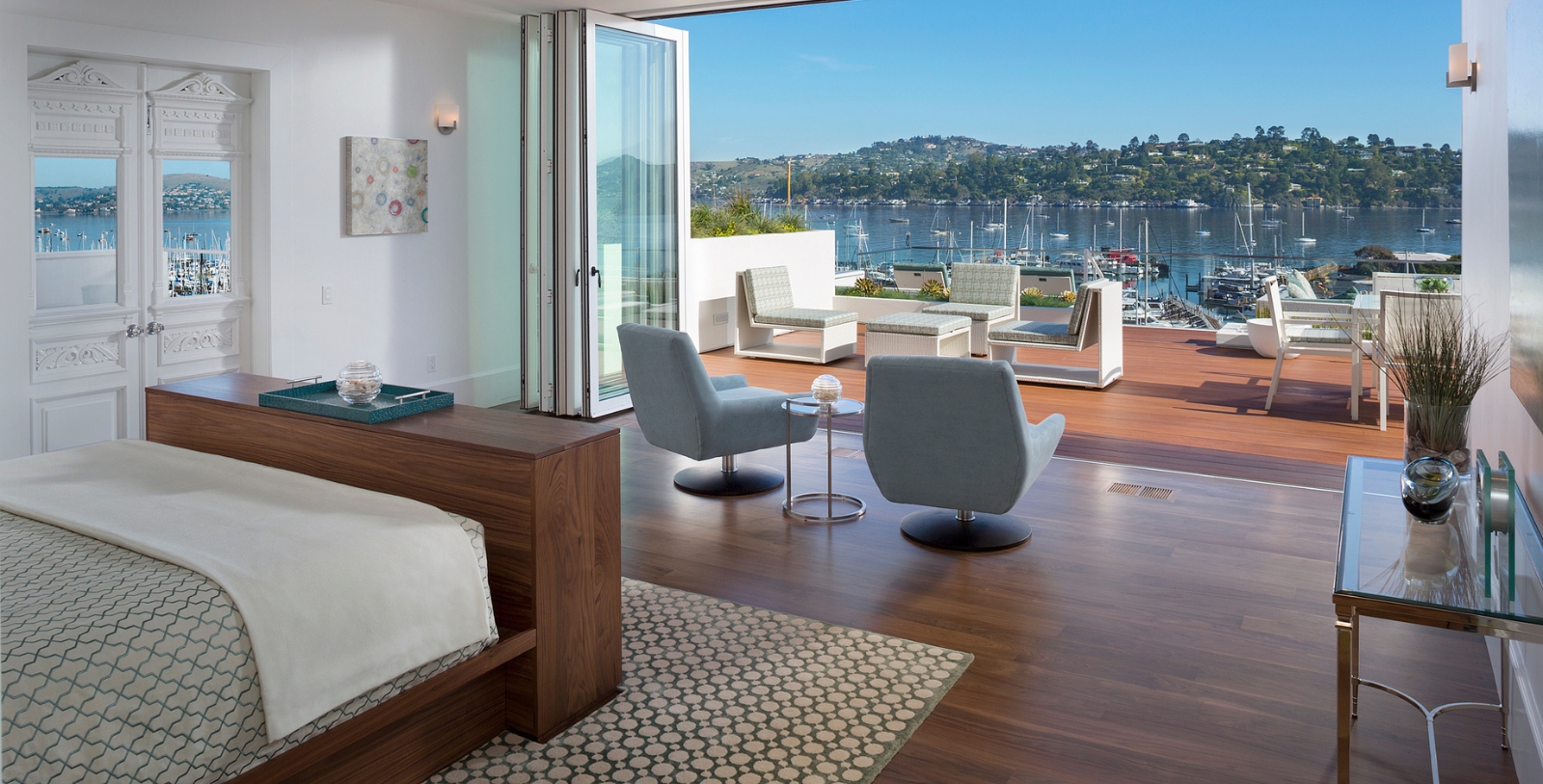 a room with a view of water and a bay