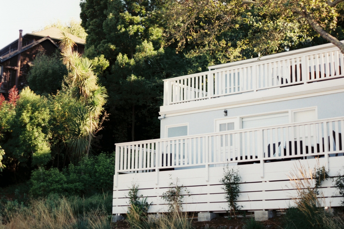 a white house with a white railing