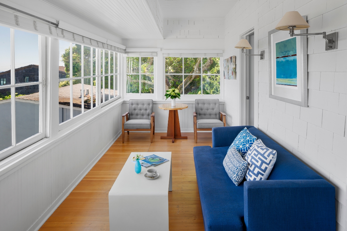 a living room with a couch and chairs