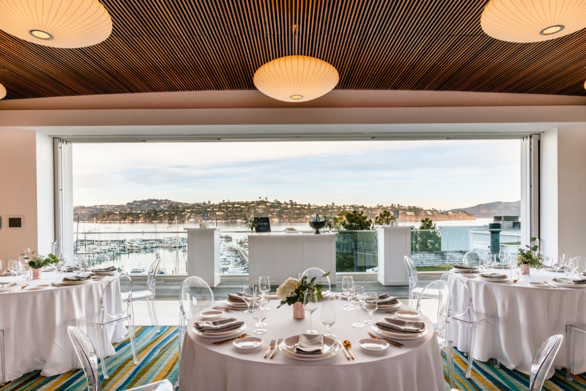 a room with a view of water and boats