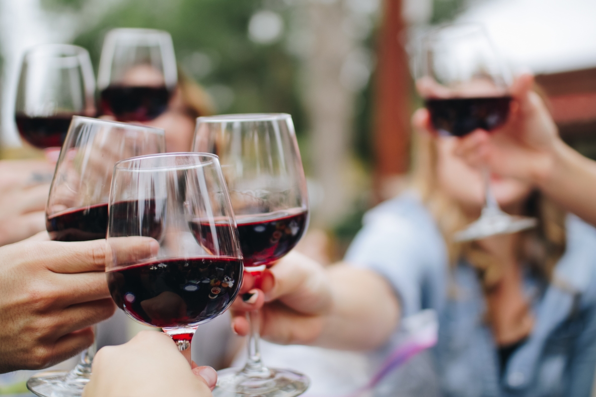 a group of people holding wine glasses