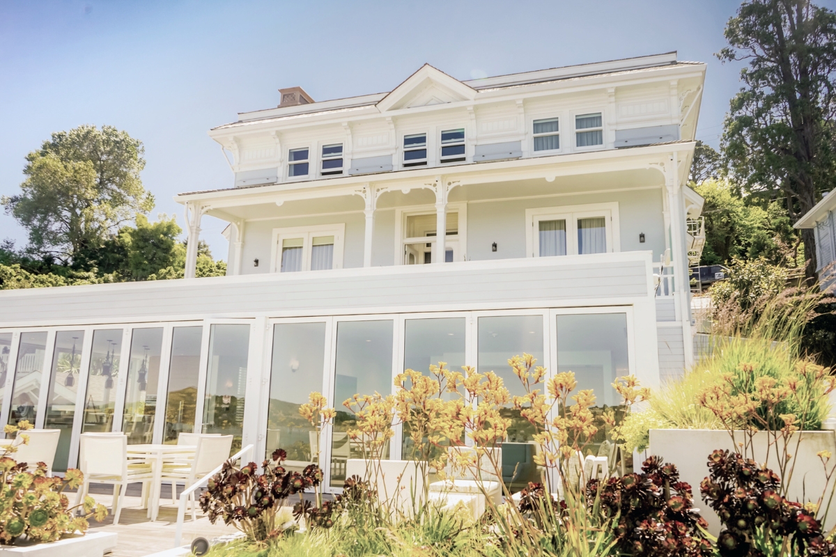 a large white house with a garden