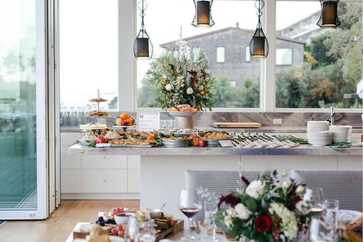 a buffet table with food and flowers