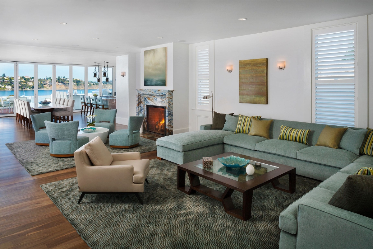 a living room with a fireplace and a large couch