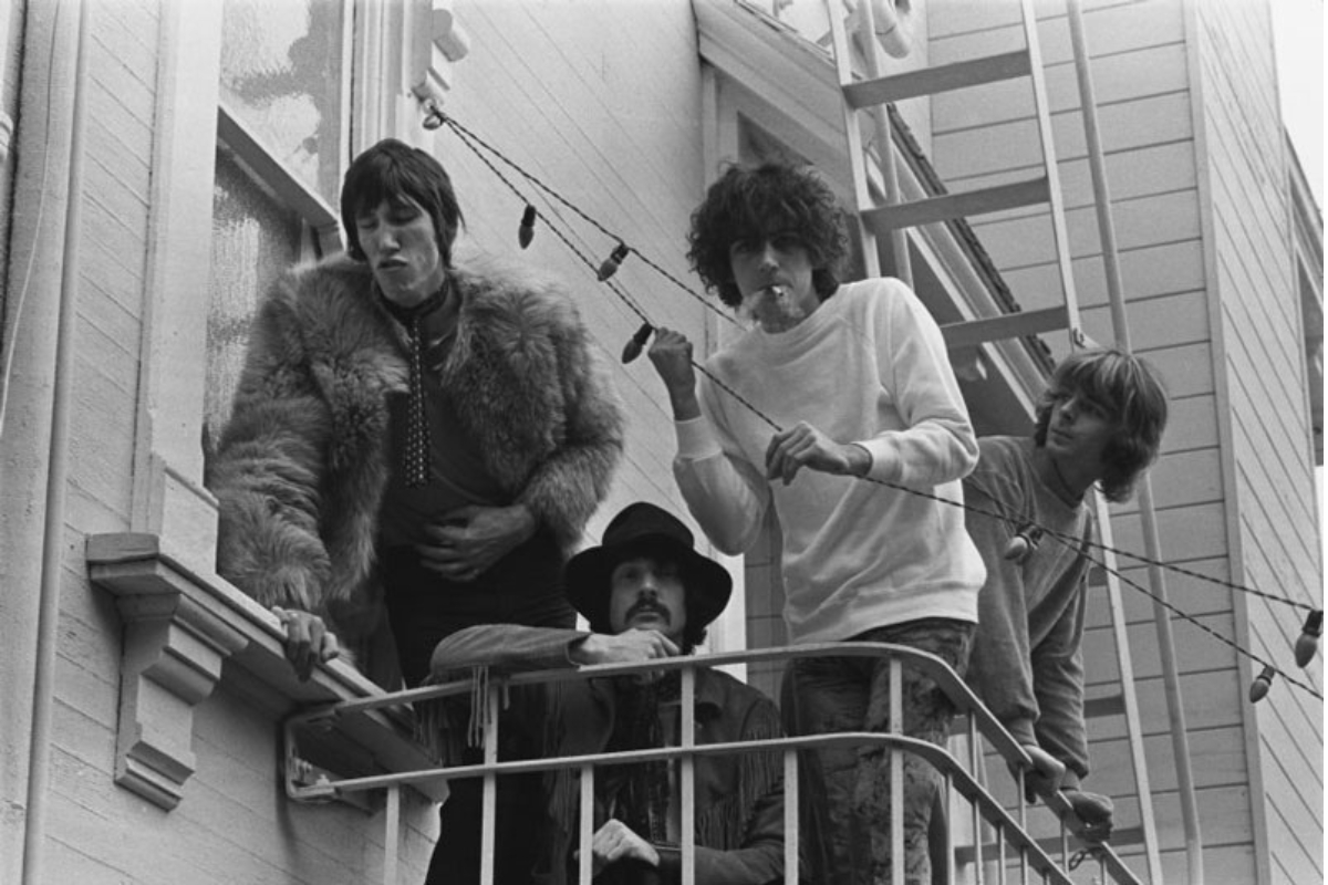 a group of men standing on a balcony