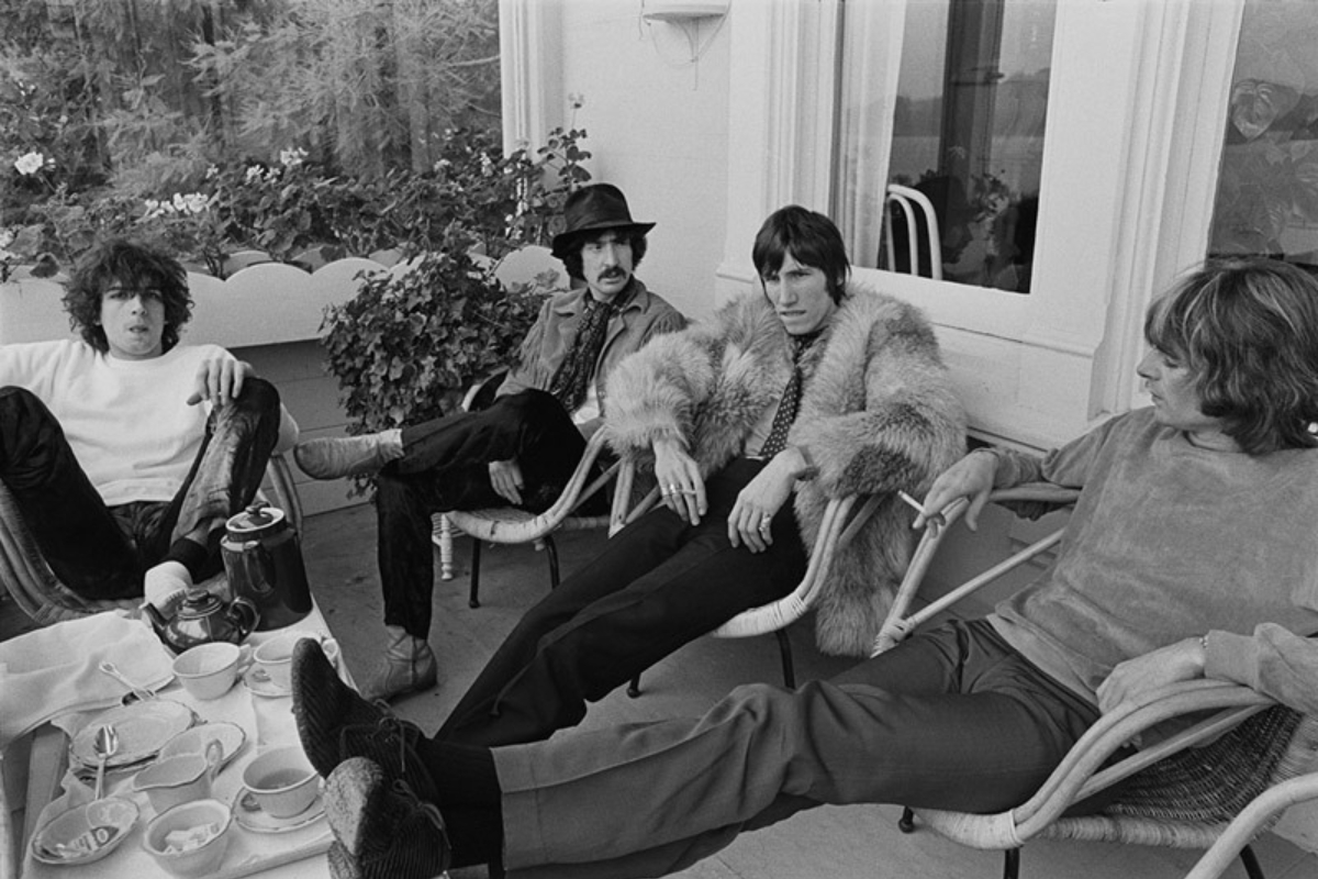 a group of men sitting on chairs