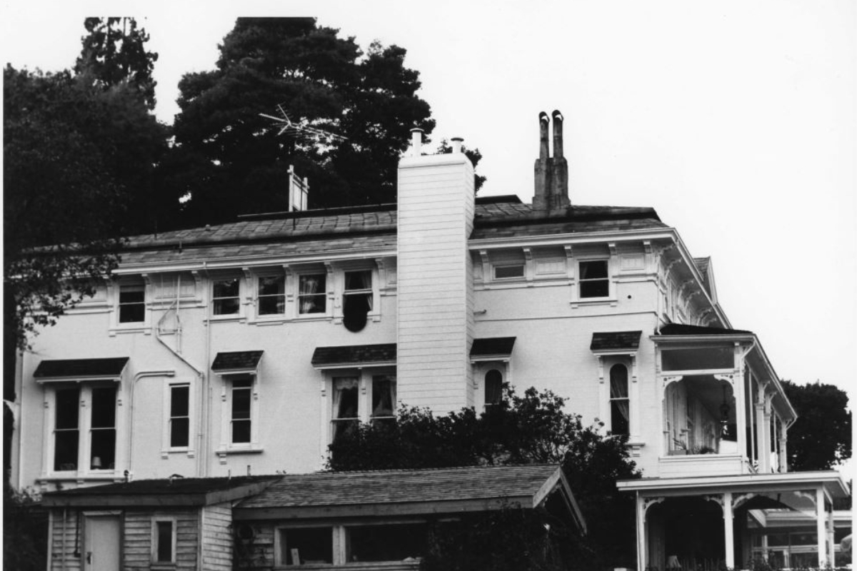 a large white house with a chimney