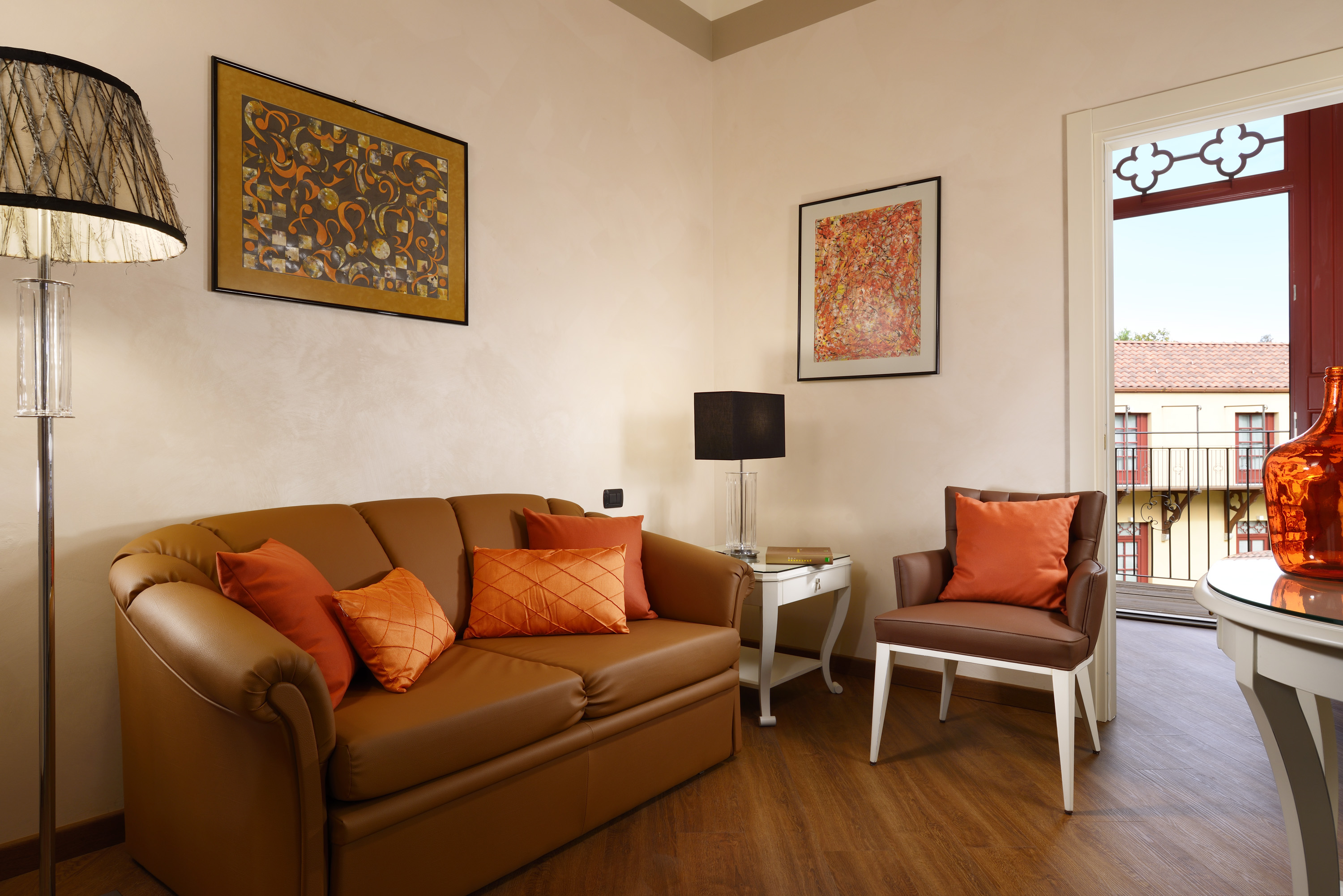 a living room with a couch and chairs